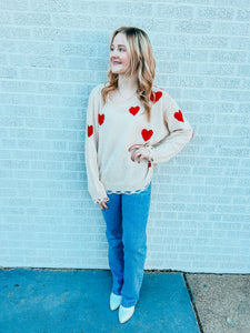 Distressed red heart sweater