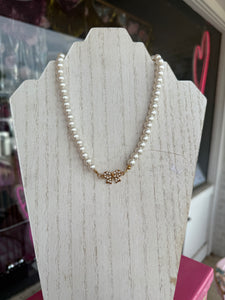 Pearl w/gold bow necklace