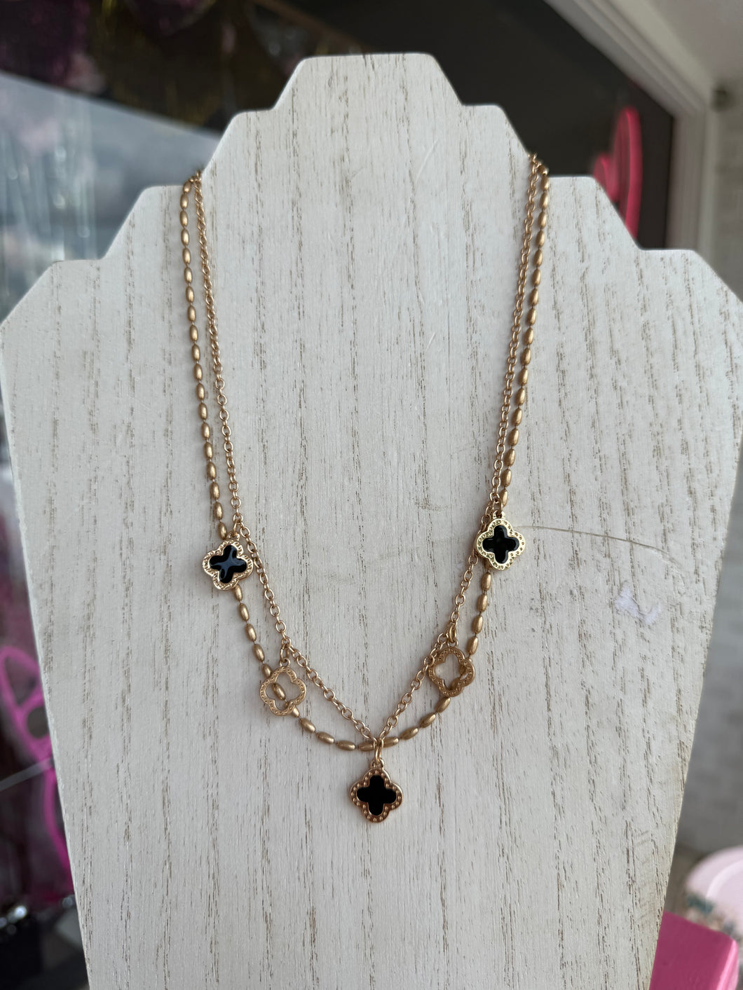 Black gold clover charm necklace