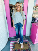 Load image into Gallery viewer, Distressed dark wash crop raw hem jeans
