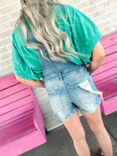 Load image into Gallery viewer, Medium wash distressed overalls

